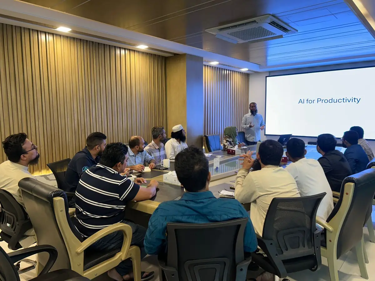 Apex DMIT team members in the conference room during an AI for Productivity session