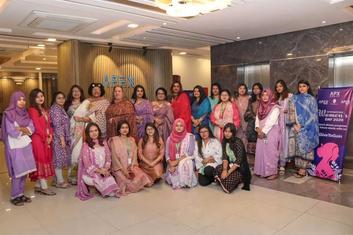 Apex DMIT colleagues gathered in the office lobby for an International Women's Day celebration